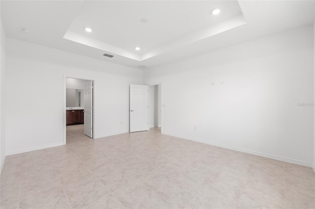 7536 SW 60th St, Ocala, FL 34476 - spare room featuring a raised ceiling, recessed lighting, and baseboards