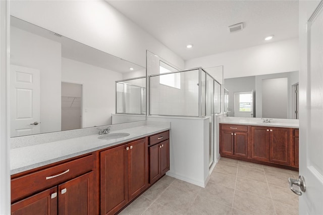 7536 SW 60th St, Ocala, FL 34476 - full bath featuring a stall shower, two vanities, tile patterned flooring, a spacious closet, and recessed lighting