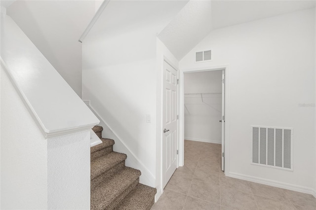 7536 SW 60th St, Ocala, FL 34476 - stairs with baseboards, tile patterned floors, and vaulted ceiling