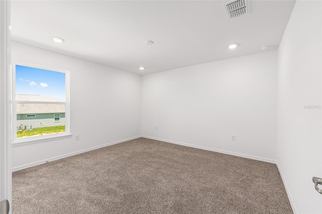 7536 SW 60th St, Ocala, FL 34476 - spare room with carpet flooring, baseboards, and recessed lighting