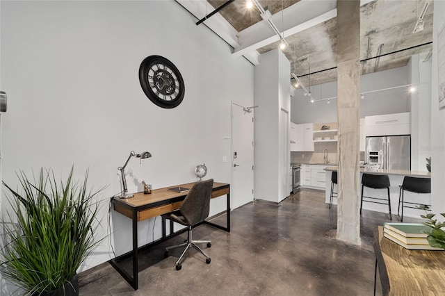302 SE Broadway St Unit 240, Ocala, FL 34471 - office space featuring a towering ceiling, finished concrete flooring, and a sink