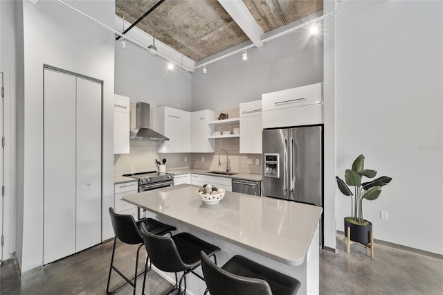 302 SE Broadway St Unit 240, Ocala, FL 34471 - kitchen featuring wall chimney range hood, track lighting, open shelves, appliances with stainless steel finishes, and finished concrete flooring