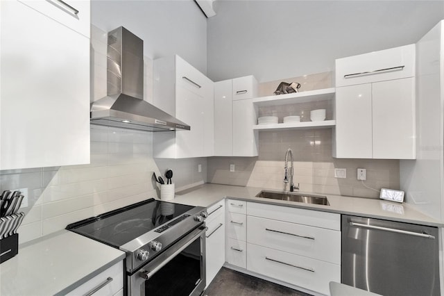 302 SE Broadway St Unit 240, Ocala, FL 34471 - kitchen featuring stainless steel appliances, a sink, wall chimney exhaust hood, decorative backsplash, and modern cabinets