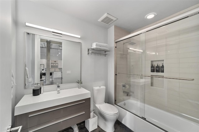 302 SE Broadway St Unit 240, Ocala, FL 34471 - full bathroom featuring toilet, bath / shower combo with glass door, and vanity