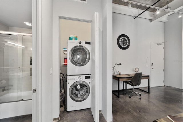 302 SE Broadway St Unit 240, Ocala, FL 34471 - clothes washing area with stacked washer / drying machine and an office area