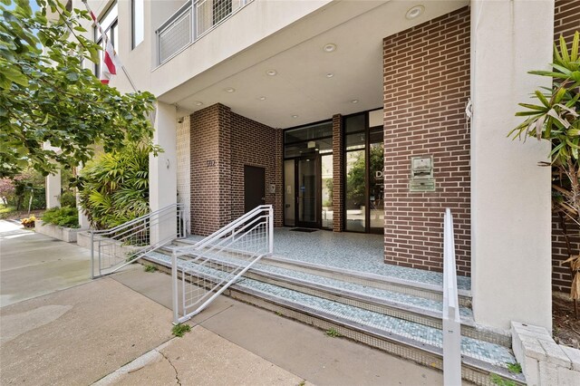 302 SE Broadway St Unit 240, Ocala, FL 34471 - view of exterior entry featuring brick siding