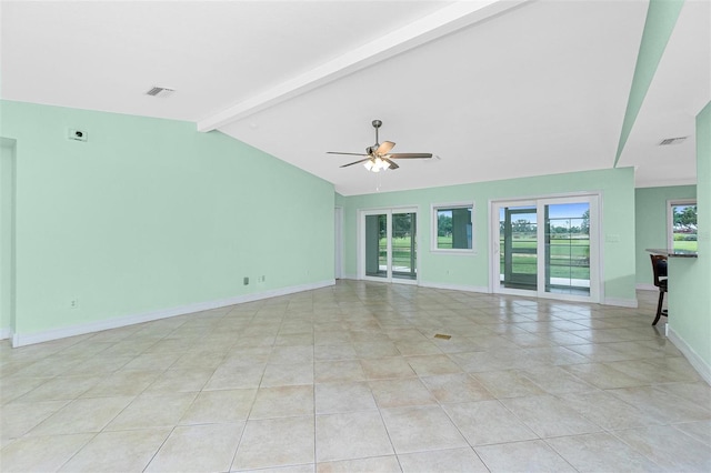 unfurnished living room featuring a ceiling fan, light tile patterned flooring, and baseboards