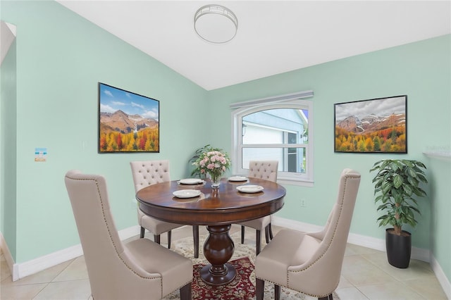 dining space with baseboards and light tile patterned floors