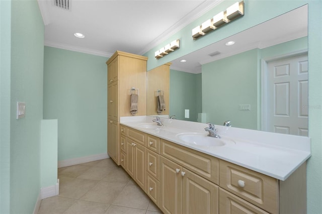 bathroom featuring ornamental molding, baseboards, double vanity, tile patterned floors, and recessed lighting