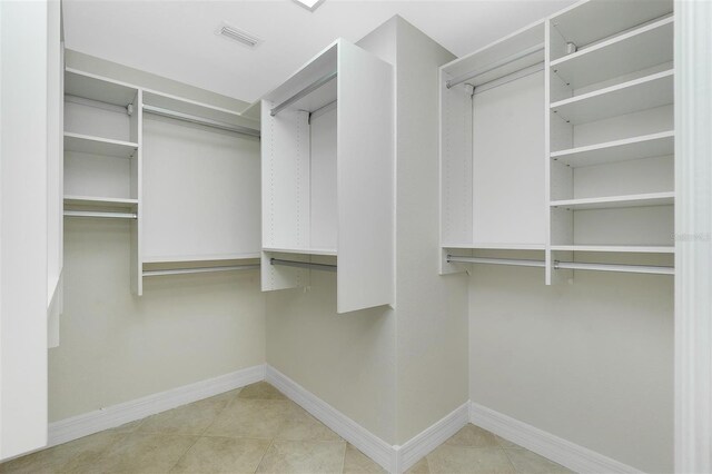 walk in closet featuring tile patterned floors