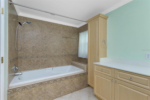 bathroom featuring crown molding, tile patterned flooring, and tiled shower / bath