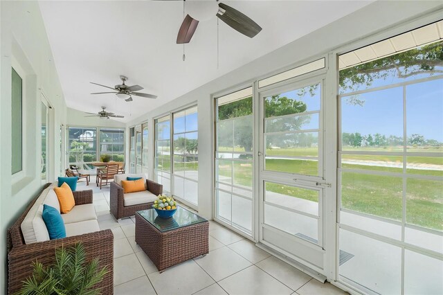 sunroom with a ceiling fan and outdoor lounge area