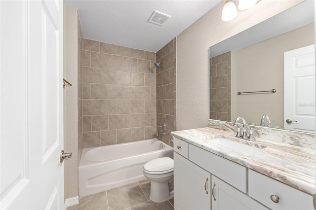 17645 SW 112th Ln, Dunnellon, FL 34432 - bathroom featuring tile patterned flooring, toilet, washtub / shower combination, vanity, and a textured ceiling