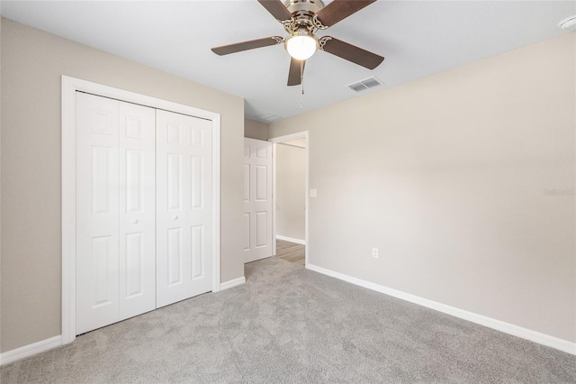 17645 SW 112th Ln, Dunnellon, FL 34432 - unfurnished bedroom featuring carpet floors, baseboards, a closet, and a ceiling fan