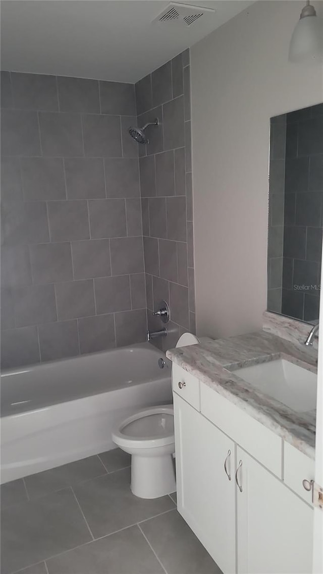 17645 SW 112th Ln, Dunnellon, FL 34432 - bathroom featuring tile patterned flooring, shower / washtub combination, vanity, and toilet