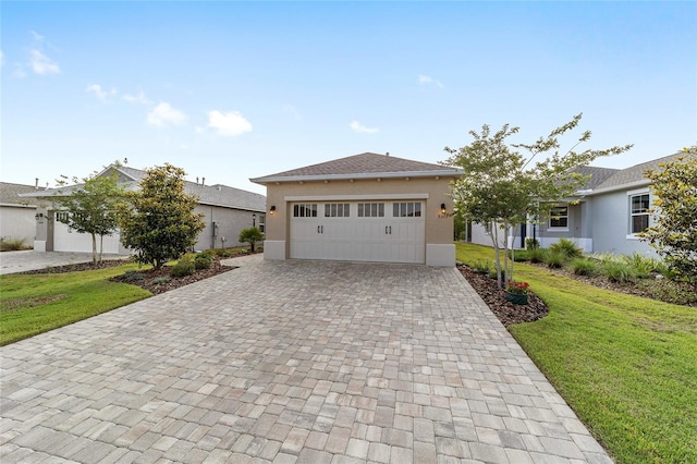 9309 SW 106th Ave, Ocala, FL 34481 - ranch-style house with decorative driveway, stucco siding, a front yard, and an attached garage