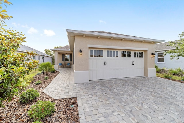 9309 SW 106th Ave, Ocala, FL 34481 - garage featuring decorative driveway