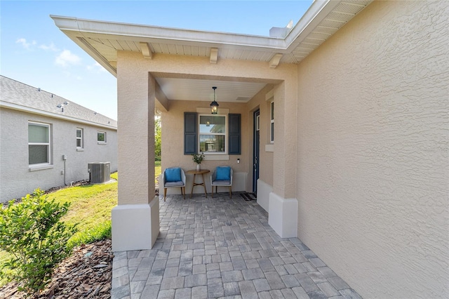 9309 SW 106th Ave, Ocala, FL 34481 - property entrance featuring stucco siding and central AC unit