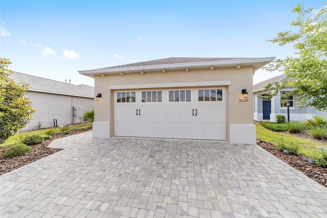 9309 SW 106th Ave, Ocala, FL 34481 - garage with decorative driveway