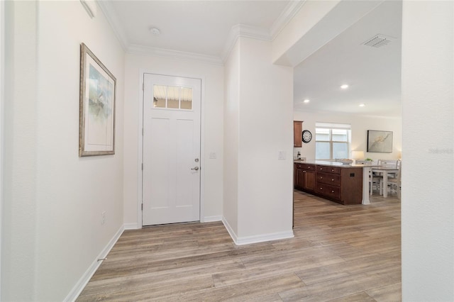 9309 SW 106th Ave, Ocala, FL 34481 - entryway with ornamental molding, light wood finished floors, baseboards, and recessed lighting