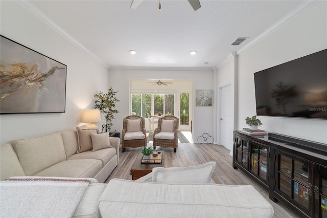 9309 SW 106th Ave, Ocala, FL 34481 - living room with a ceiling fan, light wood finished floors, crown molding, and recessed lighting