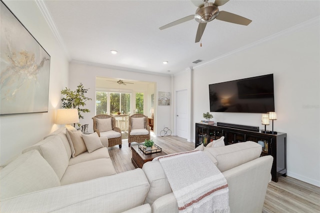 9309 SW 106th Ave, Ocala, FL 34481 - living room featuring light wood finished floors, a ceiling fan, crown molding, baseboards, and recessed lighting