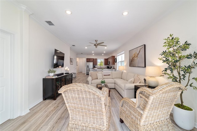 9309 SW 106th Ave, Ocala, FL 34481 - living area featuring a ceiling fan, light wood-style floors, recessed lighting, crown molding, and baseboards