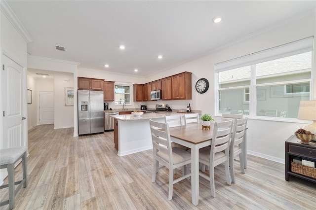 9309 SW 106th Ave, Ocala, FL 34481 - dining area featuring light wood-style floors, recessed lighting, crown molding, and baseboards