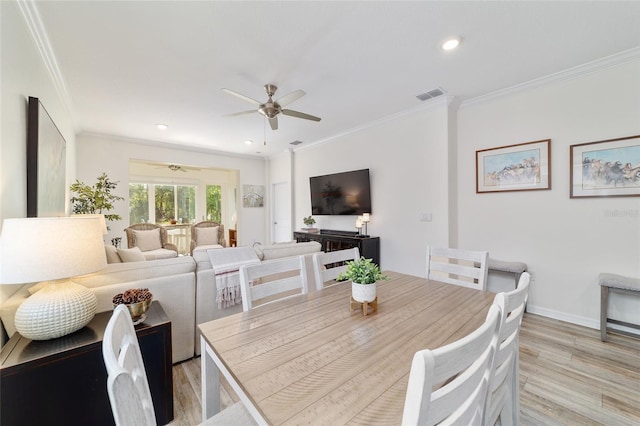9309 SW 106th Ave, Ocala, FL 34481 - dining space featuring light wood-style flooring, a ceiling fan, crown molding, recessed lighting, and baseboards