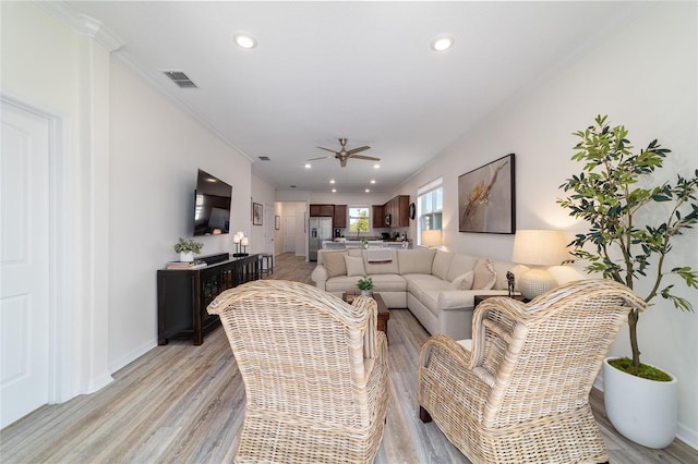 9309 SW 106th Ave, Ocala, FL 34481 - living area featuring light wood finished floors, ceiling fan, recessed lighting, baseboards, and crown molding