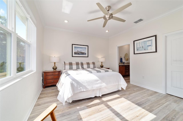 9309 SW 106th Ave, Ocala, FL 34481 - bedroom featuring light wood-type flooring, baseboards, crown molding, ensuite bath, and ceiling fan