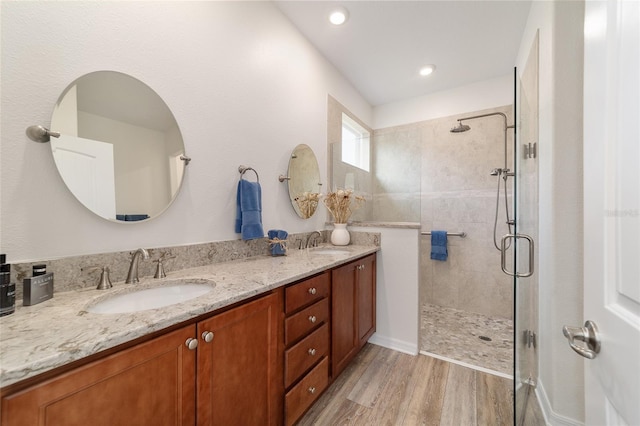9309 SW 106th Ave, Ocala, FL 34481 - full bath with a tile shower, double vanity, wood finished floors, and recessed lighting