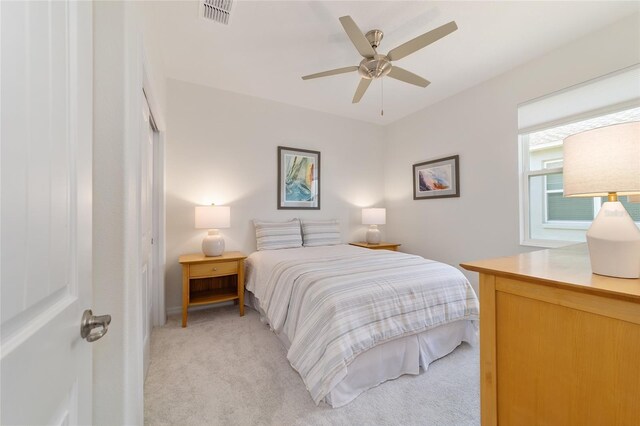 9309 SW 106th Ave, Ocala, FL 34481 - bedroom with light carpet and ceiling fan