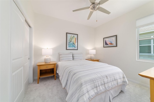 9309 SW 106th Ave, Ocala, FL 34481 - bedroom featuring light colored carpet, a closet, baseboards, and a ceiling fan