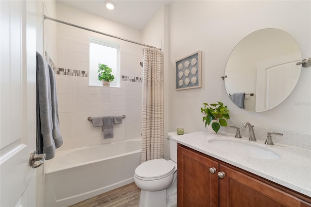 9309 SW 106th Ave, Ocala, FL 34481 - full bathroom featuring wood finished floors, toilet, vanity, and shower / tub combo