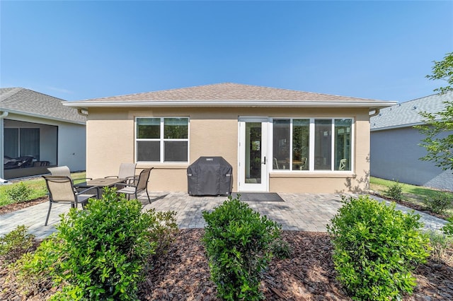 9309 SW 106th Ave, Ocala, FL 34481 - back of house with stucco siding and a patio