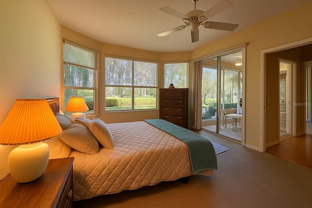 8926 SW 192nd Court Rd, Dunnellon, FL 34432 - carpeted bedroom featuring access to outside, a ceiling fan, and baseboards