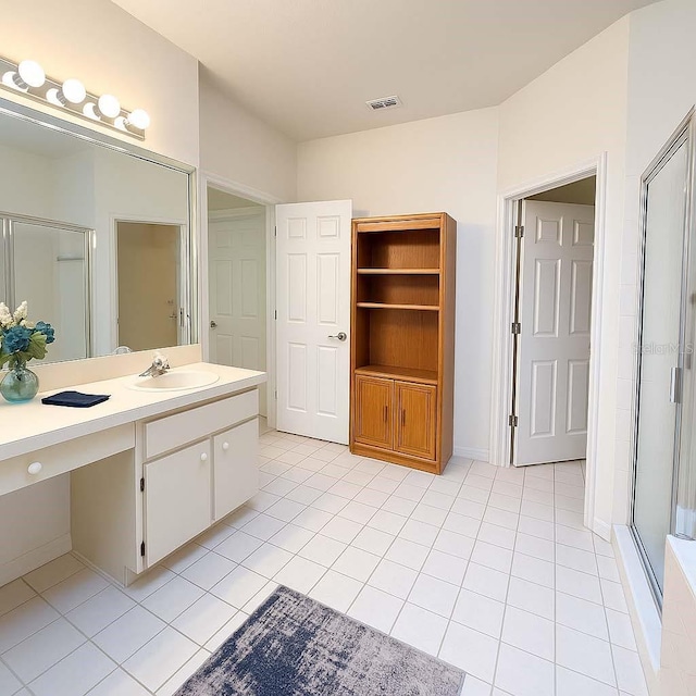 8926 SW 192nd Court Rd, Dunnellon, FL 34432 - full bathroom featuring tile patterned flooring, a shower stall, and vanity