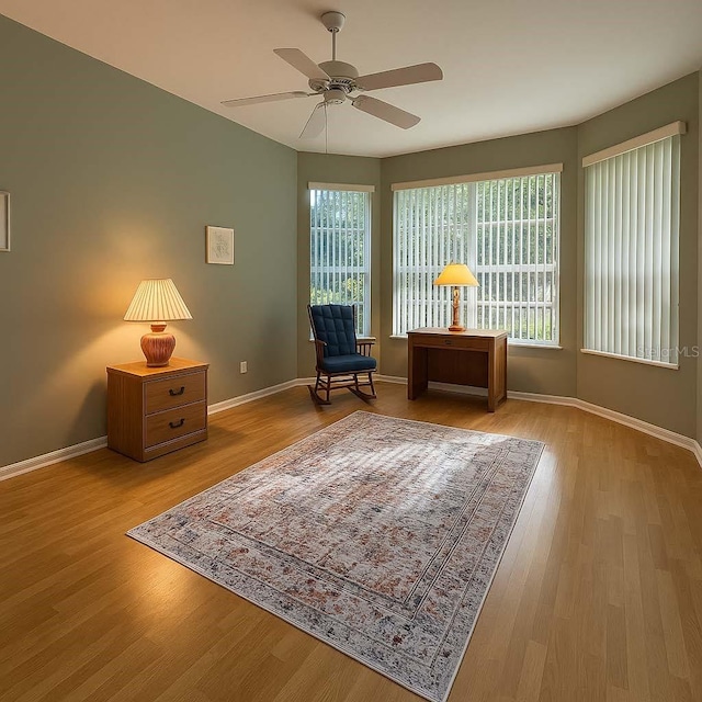 8926 SW 192nd Court Rd, Dunnellon, FL 34432 - living area with a ceiling fan, healthy amount of natural light, baseboards, and wood finished floors