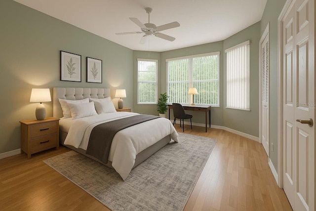 8926 SW 192nd Court Rd, Dunnellon, FL 34432 - bedroom with light wood-style floors, baseboards, and ceiling fan