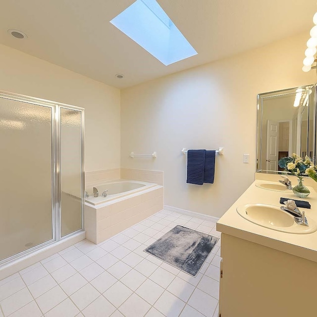 8926 SW 192nd Court Rd, Dunnellon, FL 34432 - full bathroom featuring tile patterned flooring, a bath, a skylight, a stall shower, and double vanity