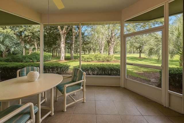 8926 SW 192nd Court Rd, Dunnellon, FL 34432 - sunroom / solarium with ceiling fan, tile patterned floors, plenty of natural light, and outdoor dining space
