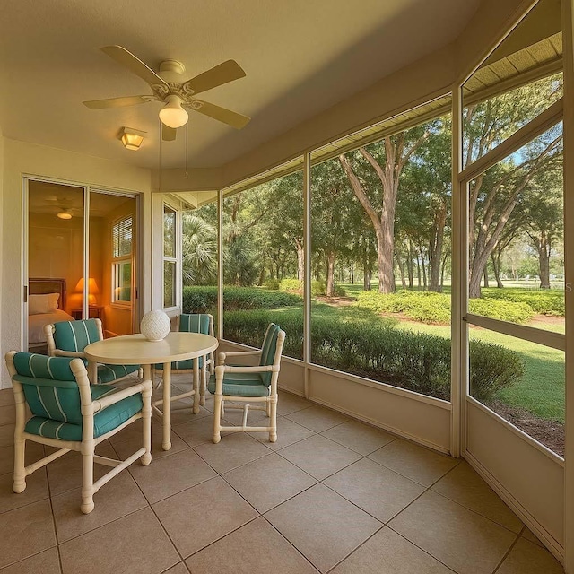 8926 SW 192nd Court Rd, Dunnellon, FL 34432 - sunroom with ceiling fan and outdoor dining space