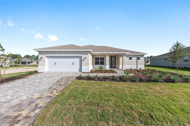 10569 SW 98th Pl, Ocala, FL 34481 - single story home with a garage, a front yard, stucco siding, and decorative driveway