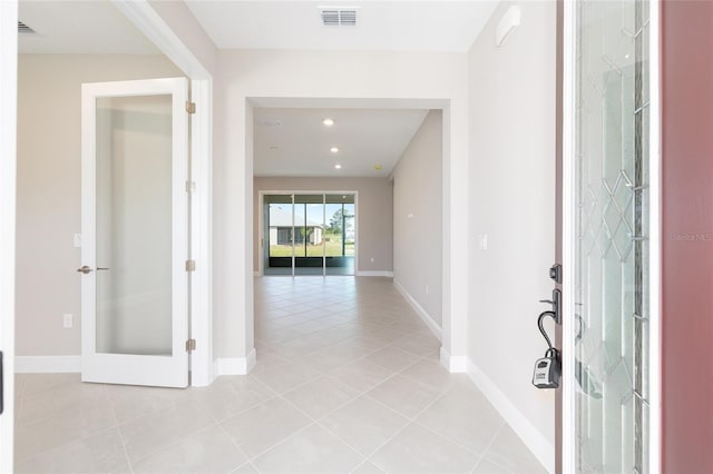 10569 SW 98th Pl, Ocala, FL 34481 - entryway featuring light tile patterned floors, french doors, baseboards, and recessed lighting