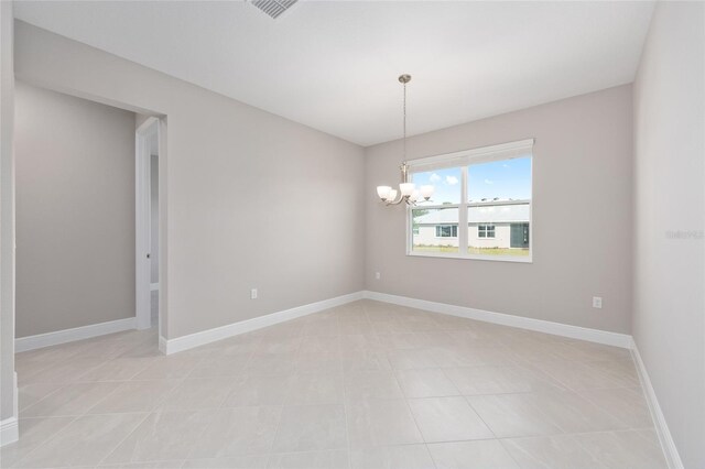10569 SW 98th Pl, Ocala, FL 34481 - unfurnished room with a chandelier, light tile patterned floors, and baseboards