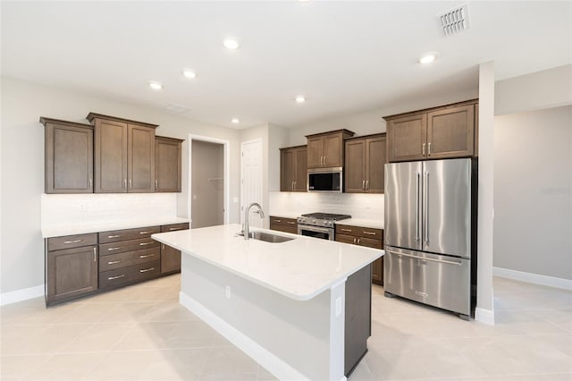 10569 SW 98th Pl, Ocala, FL 34481 - kitchen with stainless steel appliances, a sink, baseboards, backsplash, and light countertops