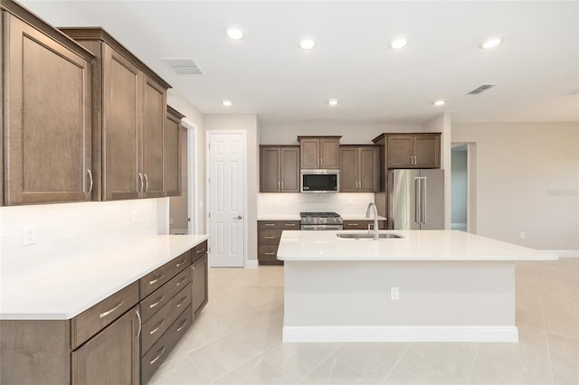 10569 SW 98th Pl, Ocala, FL 34481 - kitchen with appliances with stainless steel finishes, a sink, decorative backsplash, light countertops, and recessed lighting