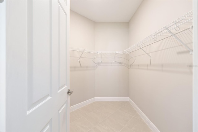 10569 SW 98th Pl, Ocala, FL 34481 - walk in closet featuring light tile patterned flooring
