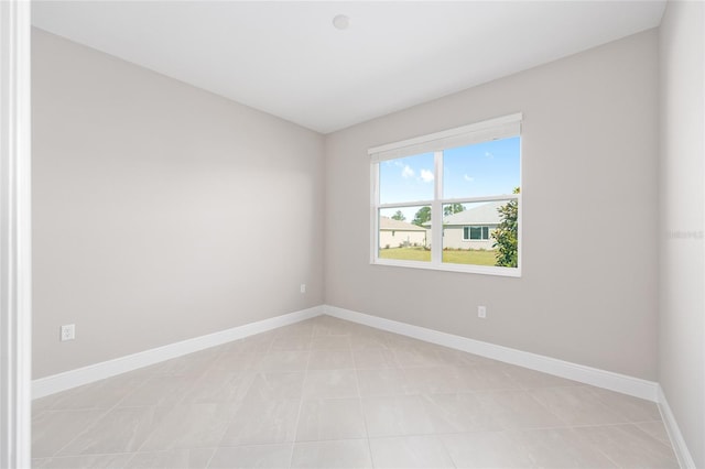 10569 SW 98th Pl, Ocala, FL 34481 - spare room with baseboards and light tile patterned flooring